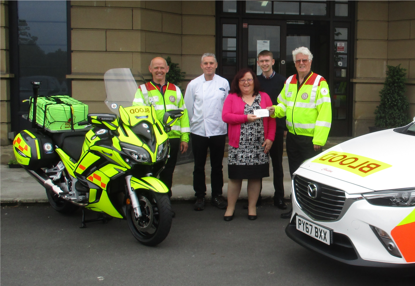 Blood Bikes Cumbria receiving the donation